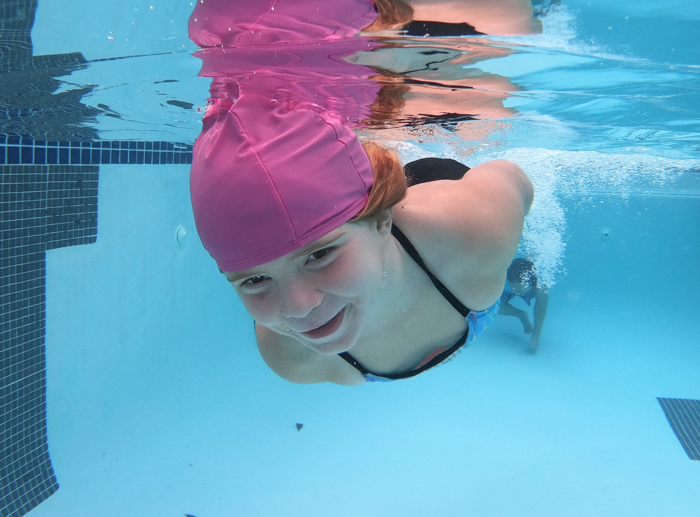 Child Swimming Under Water